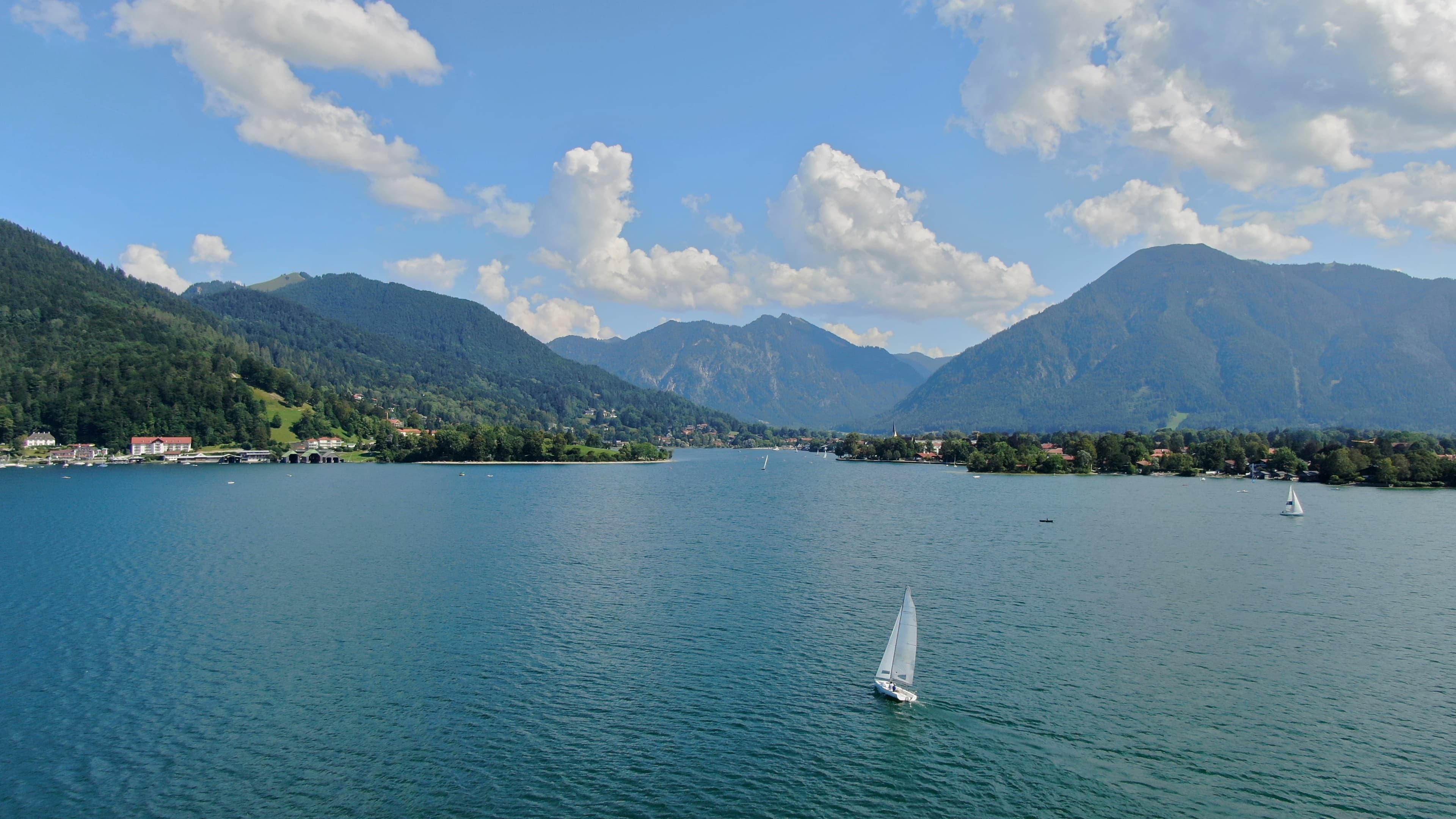 Lake Tegernsee with a sailing boat and mountain backdrop